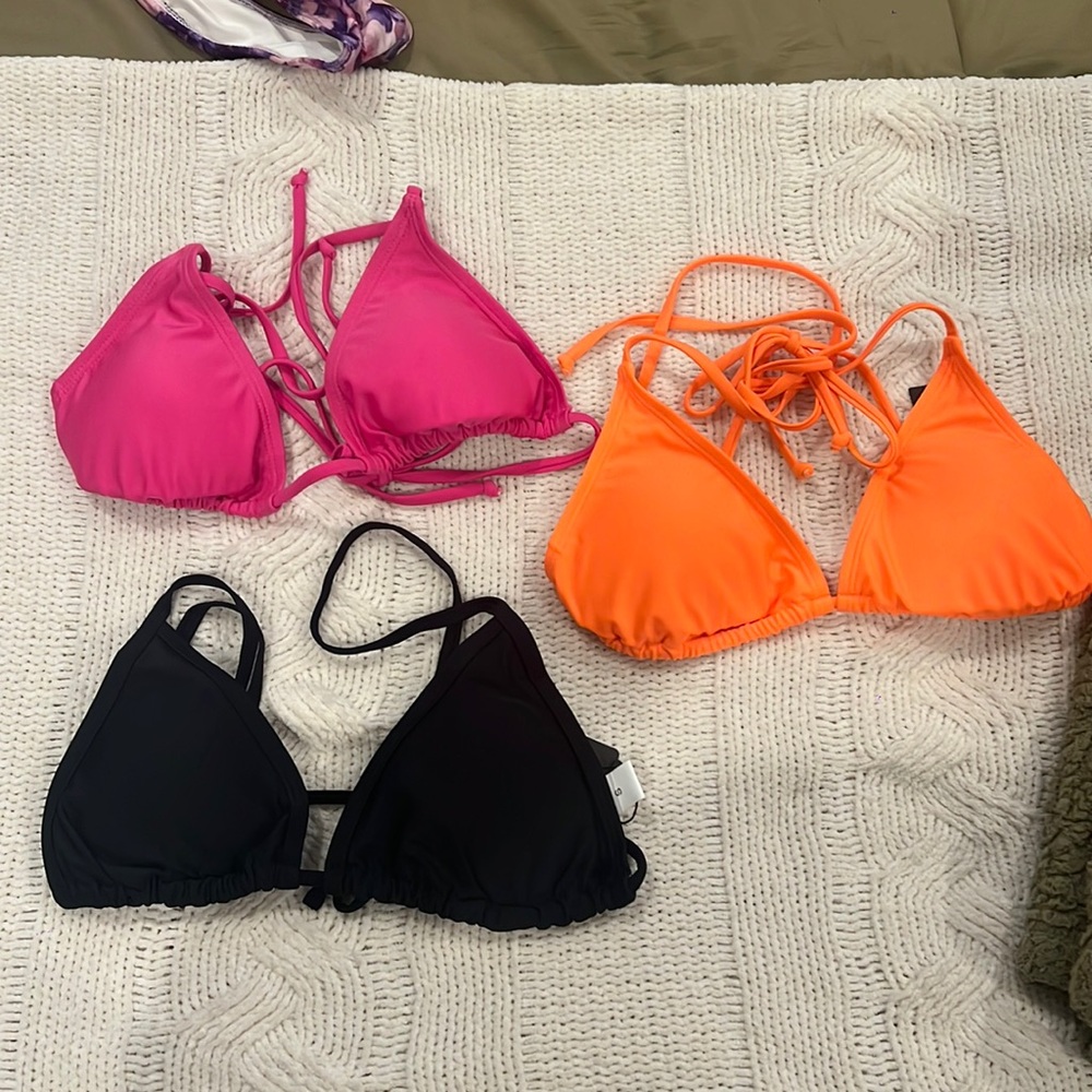 Bikini tops size small in perfect condition! Black and orange still have tags on